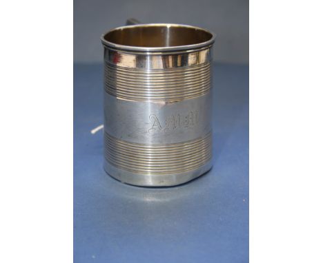 A George lll silver tapered mug, by I B, London 1811, having engine turned linear decoration, 7.5cm, 120g. Condition Report: 