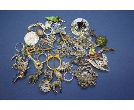 A small quantity of silver and costume jewellery, mainly brooches.