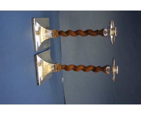 A pair of Arts & Craft silver and oak barleytwist candlesticks, by A E Jones, Chester 1913, 23cm. Condition Report: Oak stems