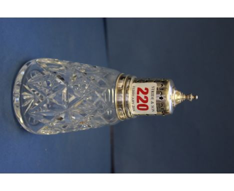 A cut glass castor having pierced silver cover, by Elkington & Co, Birmingham 1991, 16cm. 