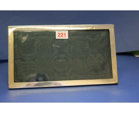 An Edwardian silver easel photograph frame, by A & J Zimmerman, Birmingham 1906, 15 x 26.5cm.