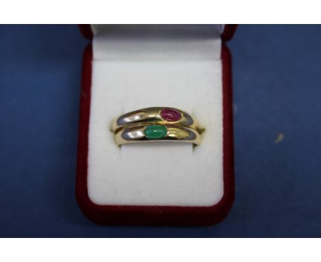 A modern 9ct gold Tudor betrothal ring set cabochon ruby; together with another example set emerald. Condition Report: Ring s