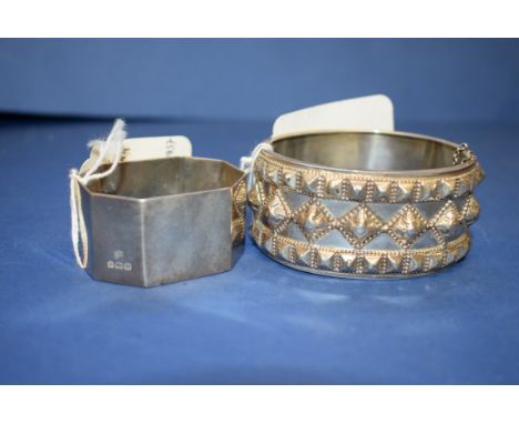 A Victorian silver hinged bangle; together with a silver napkin ring; and four other items. Condition Report: Some dents alon