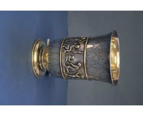A Victorian silver goblet, by George Angell, London 1871, having central band of cherubs, amid engine turned decoration, 12cm