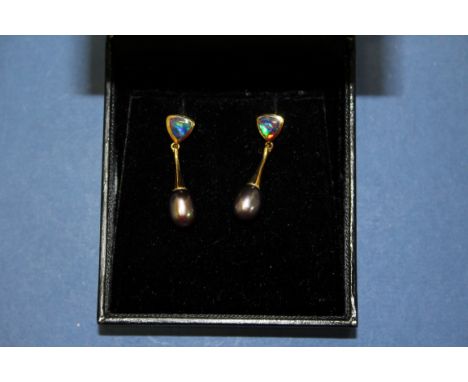 A pair of modern 18ct gold fire opal and teardrop black pearl pendant earrings.