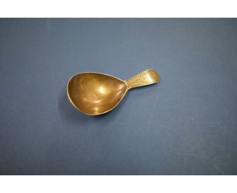 A George III brightcut silver caddy spoon, probably by George Wintle, London 1793.