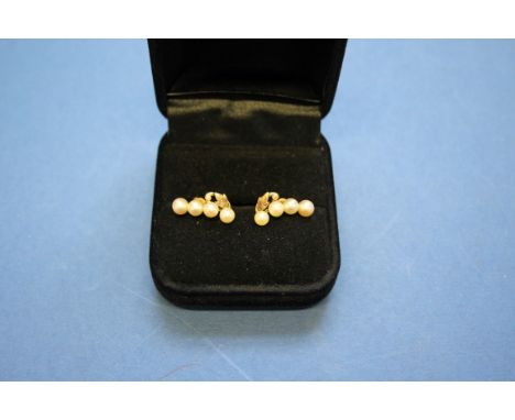 A 14k pearl ring; together with a similar pair of unmarked pearl ear studs; and an unmarked pendant/brooch set pearls.