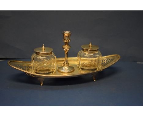 A Victorian pierced silver boat shaped ink and taper stand, by J H B & H B, Sheffield 1897, containing a pair of cut glass si