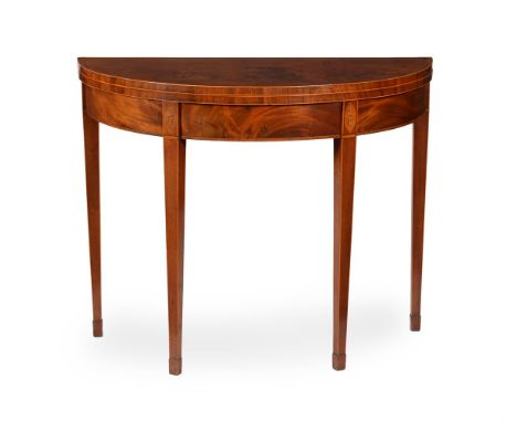 Y A George III mahogany, inlaid, and tulipwood crossbanded card table, circa 1800, of semi-elliptical outline, the hinged top