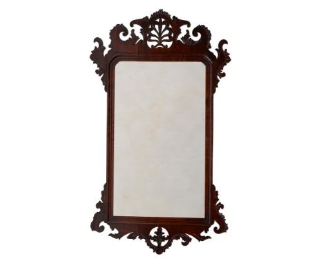A George III mahogany wall mirror, circa 1760, surmounted by a pierced anthemion and scroll cresting, 88cm high, 51cm wideCon