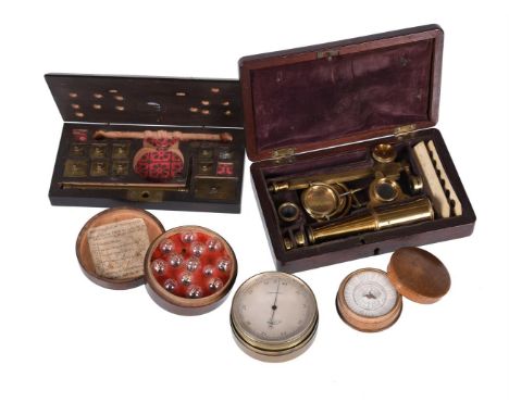 A small group of scientific instruments, comprising I W Herbert's London, a pocket microscope in mahogany case, a Tupman's po