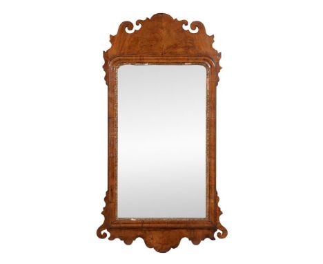 A George II walnut and parcel gilt composition wall mirror, mid 18th century, 94cm high, 54cm wideCondition Report: Marks, kn