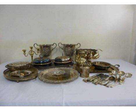 A quantity of silver plate to include trays, a punch bowl and a pair of trophy cups