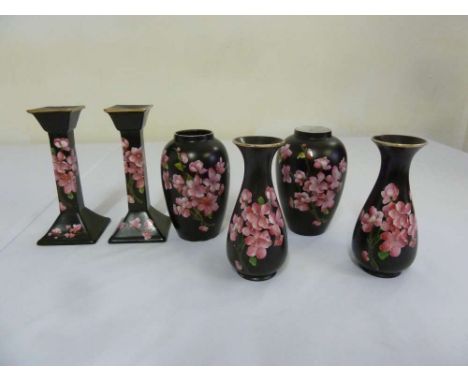 Carltonware porcelain to include four vases and a pair of candlesticks