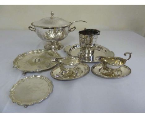 A quantity of silver plate to include a tureen and cover, ladle, sauce boat, trays and an ice bucket