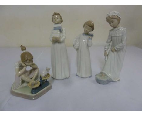 Three Nao figures and a Lladro figure 5474 of a girl weighing a cat