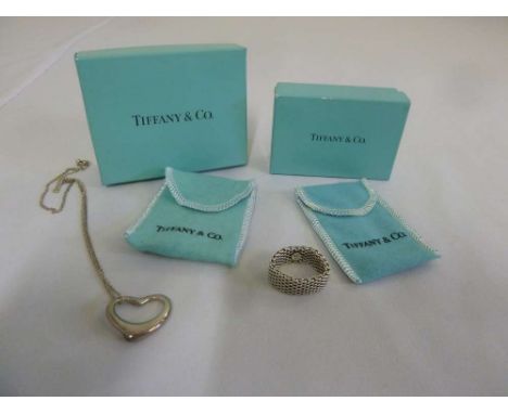 Tiffany mesh ring in original packaging and a heart pendant an chain in original packaging