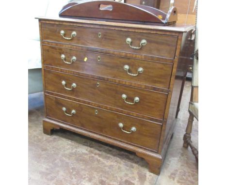 A Georgian mahogany Chest of four graduated drawers on bracket feet. AMENDMENT: NOT FORWARD