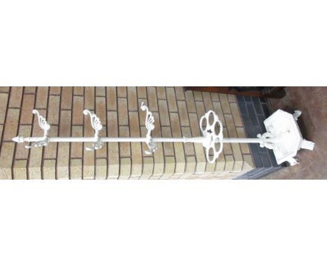 A 19th Century cast iron Hall Stand with three pairs of hooks around a central column, above a stick holder and drip pan, sta