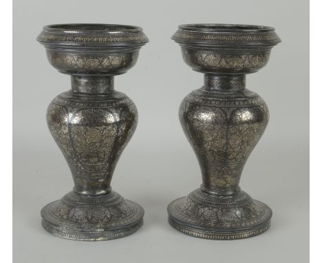 A pair of 19th Century Bidri silver inlaid baluster Vases, Deccan, The broad basin shaped tops above short necks, baluster bo