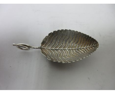 A George III silver Caddy Spoon with leaf bowl and coiled handle, London 1801, maker: Elizabeth Morley