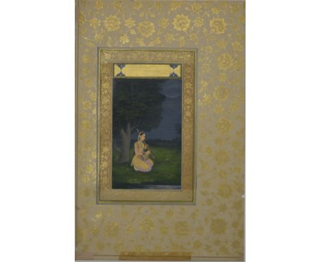 FATH CHAND (MUGHAL SCHOOL), NORTHERN INDIA circa 1750/1760Gujari Ragini, depicting a Lady seated by a tree holding a vina, si