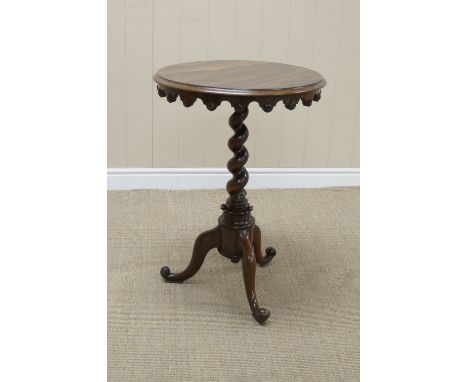 A 19th Century rosewood Occasional Table with shaped frieze on spiral column and tripod base, 20in diam