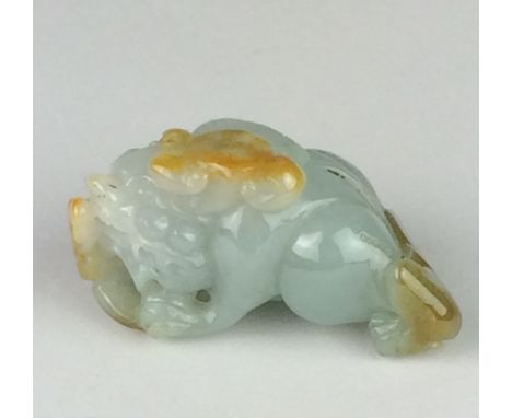 A chinese mottled and russet jade ChilongLate Qing DynastyCrouching on all fours eating lingzhi fungus, 2 1/2 in long