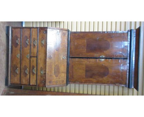 An 18th Century Dutch walnut Bureau Bookcase, the upper section enclosed by two plain doors on shallow bracket feet, 6ft 7in 