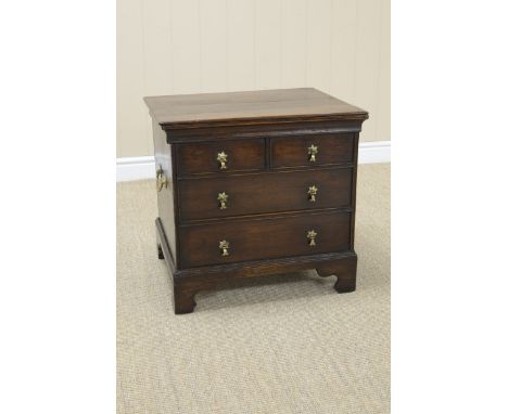 An antique oak Commode Chest with hinged top, four dummy drawers on bracket feet, 21in W