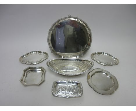 A George VI silver circular Salver with shaped rim on ball and claw feet, Sheffield 1945, a pierced oval Basket, pair of oval