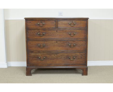 A George III mahogany Chest of two short and three long drawers on bracket feet, 3ft 9in