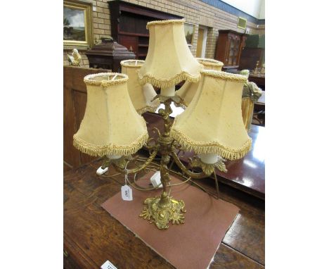 A gilt-metal four branch, five light Table Lamp with cherub figural column