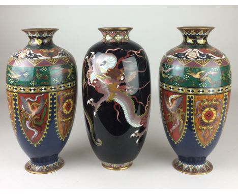 A pair of Japanese cloisonné enamel ovoid Vases, Meiji Period, Decorated with bold sinuous dragons below a diaper collar to t