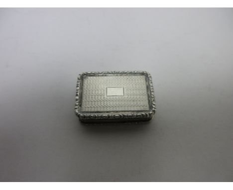 A William IV silver Vinaigrette with engine turning and vacant cartouche, floral scroll pierced grille, Birmingham 1832, make