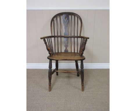 A 19th Century Windsor Elbow Chair with pierced splat and stick back, solid seat on turned leg and H stretcher