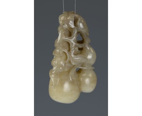 A good Chinese jade "double-gourd" pendant, 18th/19th CenturyCarved in the round as a large double gourd surrounded by leafy 