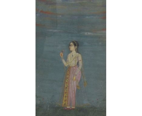 NORTHERN INDIA, 18th CENTURYA Mughal Portrait of a Lady, holding a Flowergouache with gold on paper7 x 4 1/2 in  (17.8 x 11.4