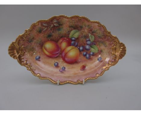 A Royal Worcester oval shaped Dish, moulded edge and shell handles, painted plums, grapes and berries on a mossy ground, sign