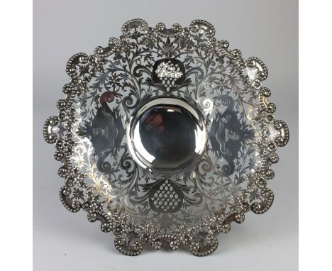 An interesting Edward VII silver armorial Tazza with beaded, chased, and pierced foliate and pineapple border incorporating t