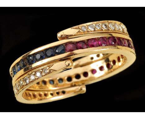 A Sapphire, Ruby and Diamond Day and Night Ring channel-set round rubies and sapphires between pavé-set brilliant-cut diamond