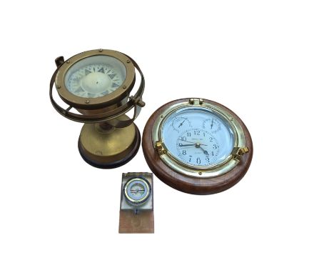 C Plath gimbal compass on stand, plastic compass and a quartz porthole clock