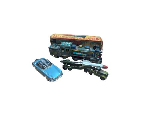 SSS Japan tinplate Mountain Locomotive, Crescent Toys 1268 Mobile Space Rocket, and a novelty table lighter modelled as a car