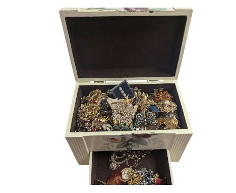 Collection of costume brooches, including ceramic, novelty and animal examples, contained within a white jewellery box