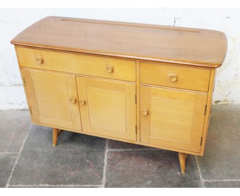 An Ercol light elm and beech sideboard. W123cm D46cm H82cm