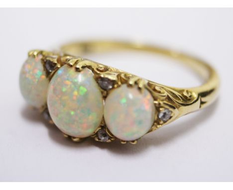 An 18ct gold opal diamond ring. Gross wt. 4.5g. Size L