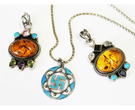 A pair of amber and multi-coloured gem stone pendants marked .925 together with a silver and enamel swastika pendant on chain