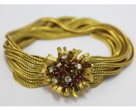 A ladies 18ct gold, diamond and ruby Bueche Girod bracelet watch. Gross wt. 65g