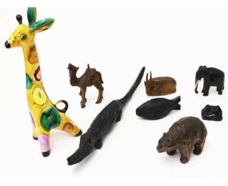 A mixed lot comprising a USSR giraffe,  a hardwood netsuke, a black forest bear and various treen