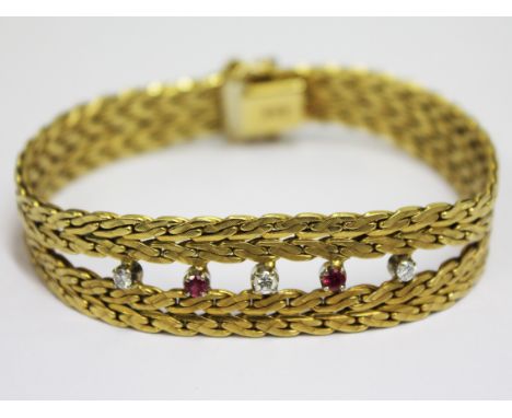 An 18ct gold diamond ruby bracelet. L20cm. Gross wt. 45g
